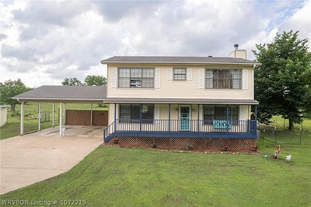 view of front of home featuring a front yard, a porch, and a carport