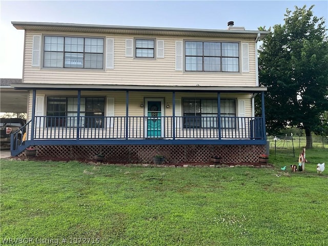 view of front of house featuring a front lawn and covered porch