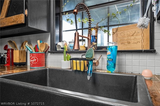 details featuring backsplash and sink