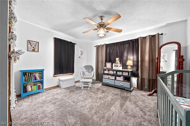 interior space with carpet flooring, ceiling fan, and a textured ceiling