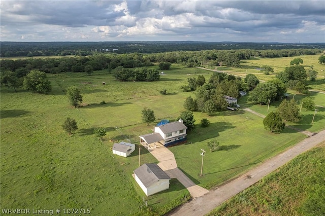 birds eye view of property featuring a rural view