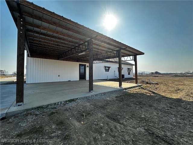 view of vehicle parking with a carport