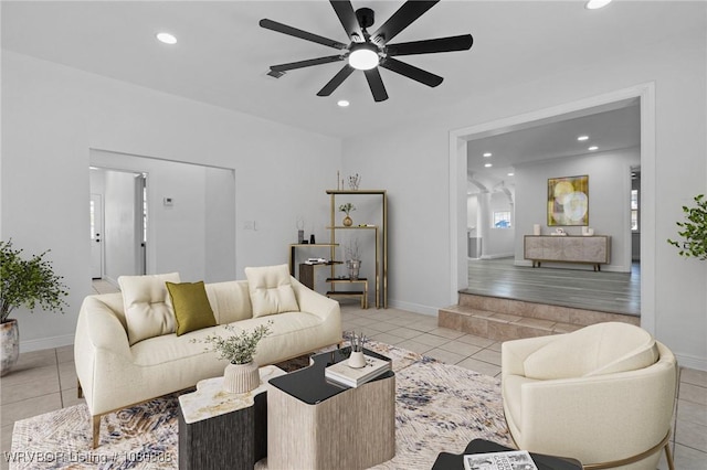 living area featuring a ceiling fan, tile patterned floors, recessed lighting, and baseboards