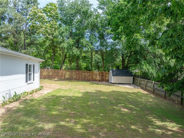 view of yard with a shed and an outbuilding