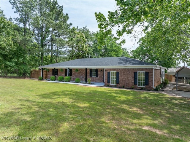 ranch-style home with brick siding and a carport
