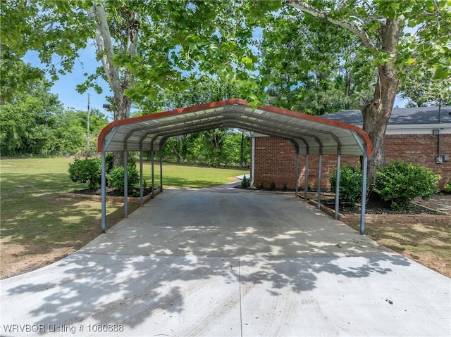 view of parking / parking lot with a carport and concrete driveway