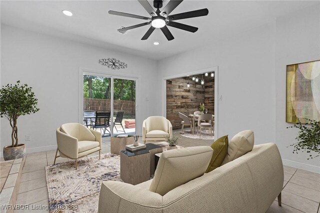 living room with light tile patterned flooring, a ceiling fan, baseboards, and recessed lighting