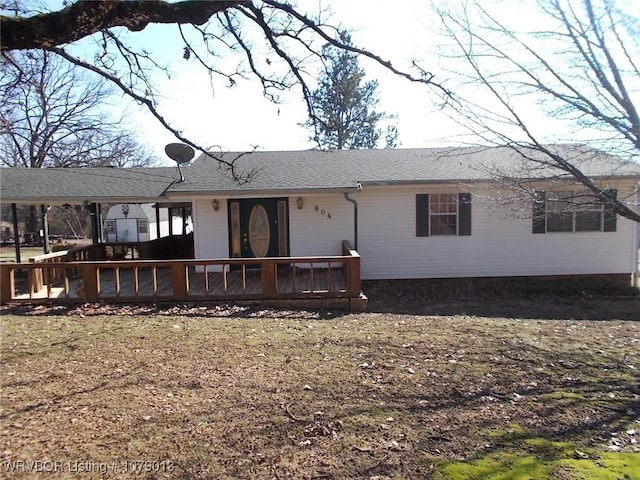 view of front facade with a wooden deck