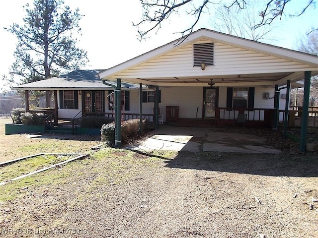 view of front of home with a carport