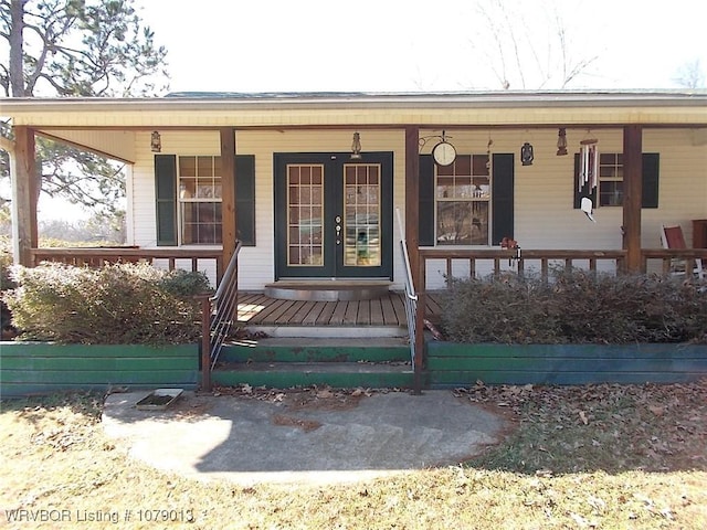 doorway to property featuring french doors and covered porch