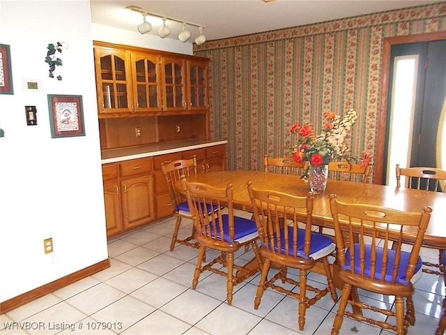 dining area with light tile patterned floors