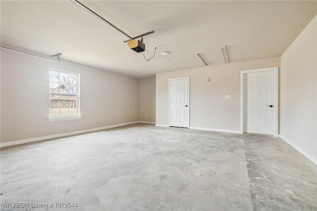 garage with a garage door opener and baseboards
