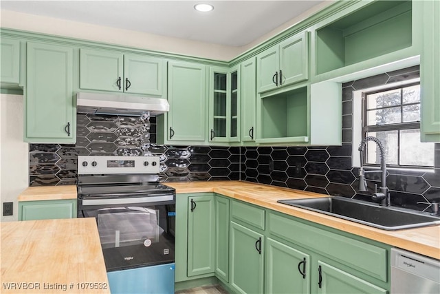 kitchen featuring under cabinet range hood, dishwasher, stainless steel range with electric stovetop, wood counters, and a sink