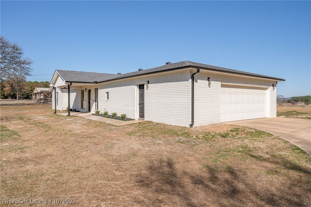 view of side of home with brick siding