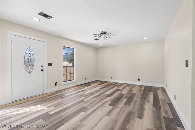 entryway with visible vents, recessed lighting, baseboards, and wood finished floors