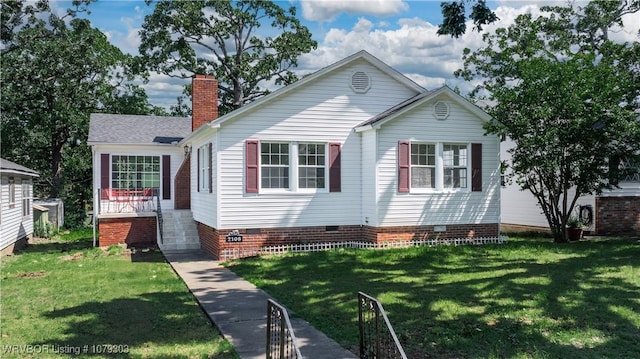2105 S R St, Fort Smith, AR 72901 - view of front of home with a front lawn, crawl space, and a chimney