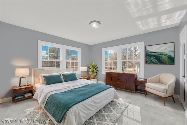 bedroom featuring baseboards