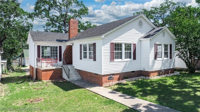 2105 S R St, Fort Smith, AR 72901 - view of side of property with crawl space, a chimney, and a lawn