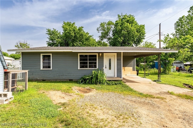 603 Oklahoma Ave, Poteau, OK 74953 - view of front facade with driveway, crawl space, an attached carport, cooling unit, and a front yard