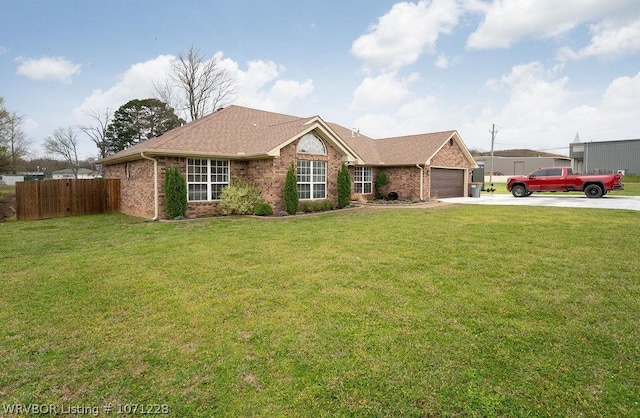 ranch-style house featuring a garage and a front yard