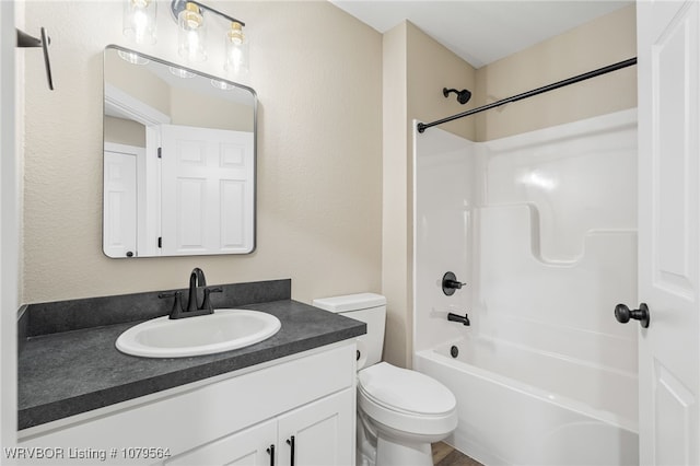 full bathroom featuring bathing tub / shower combination, toilet, and vanity
