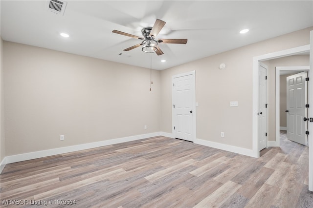 spare room featuring visible vents, baseboards, ceiling fan, recessed lighting, and light wood-type flooring