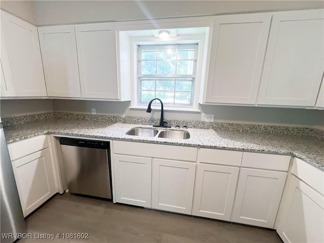 120 W Gary St, Greenwood, AR 72936 - kitchen featuring dishwasher, a sink, and white cabinets