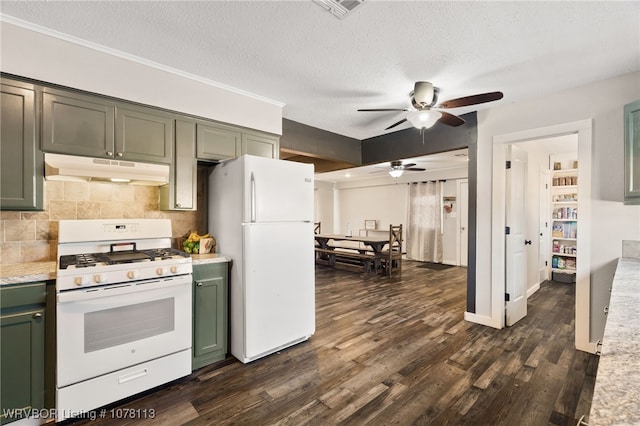 kitchen featuring white appliances, backsplash, green cabinets, a textured ceiling, and dark hardwood / wood-style flooring