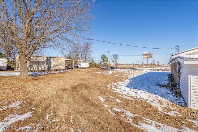 view of yard covered in snow