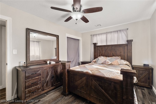 bedroom featuring ceiling fan and dark wood-type flooring