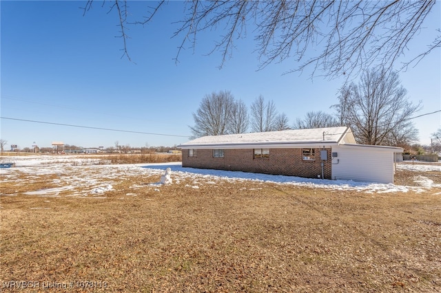 rear view of property featuring a lawn