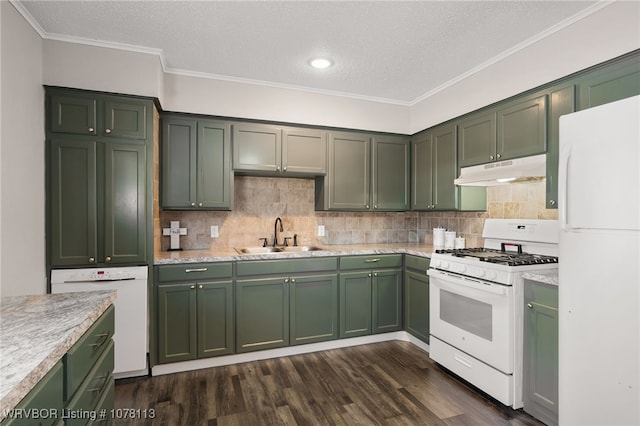 kitchen with green cabinets, sink, and white appliances