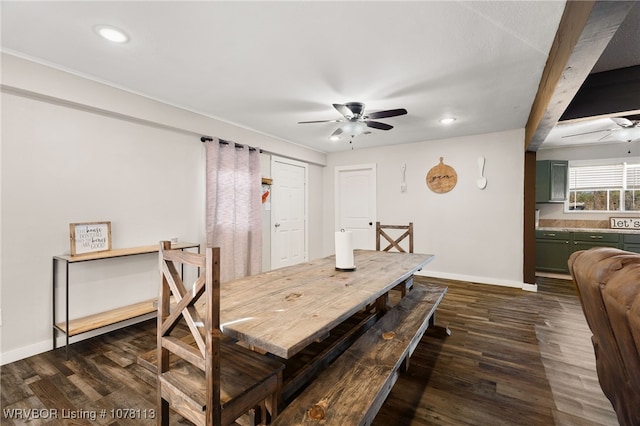 dining room featuring beam ceiling, ceiling fan, and dark hardwood / wood-style flooring