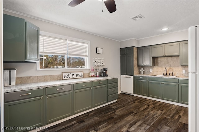 kitchen with a textured ceiling, dark hardwood / wood-style floors, tasteful backsplash, and sink