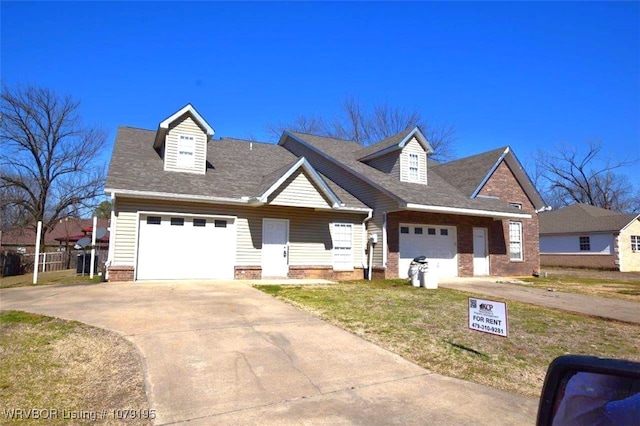 view of front facade featuring a garage, concrete driveway, brick siding, and a front lawn