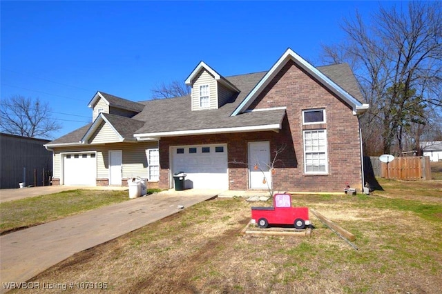 view of front facade featuring a garage, brick siding, fence, and a front lawn