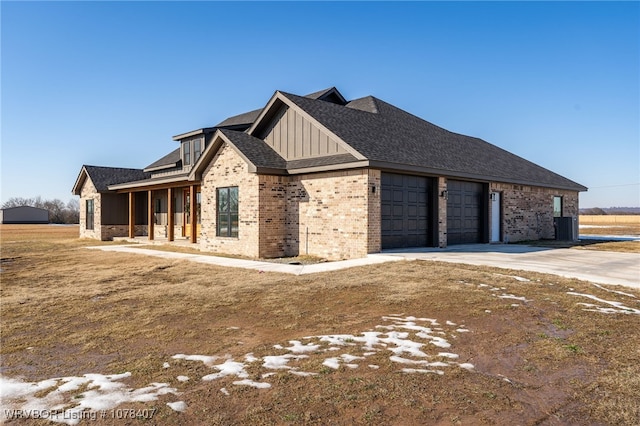 view of front of property with a garage and covered porch