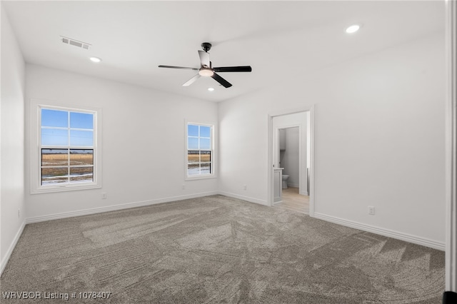 empty room featuring light carpet and ceiling fan