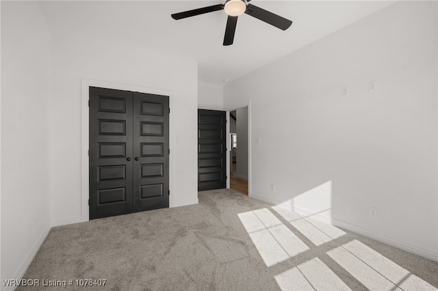 interior space with ceiling fan