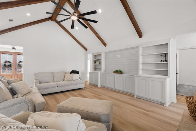 living room featuring light wood-type flooring, ceiling fan, beam ceiling, and high vaulted ceiling