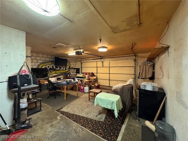 garage with concrete block wall