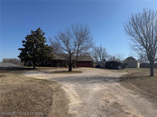 view of front facade featuring a carport and driveway