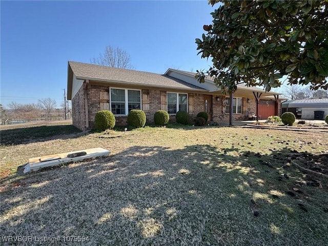 ranch-style home featuring brick siding