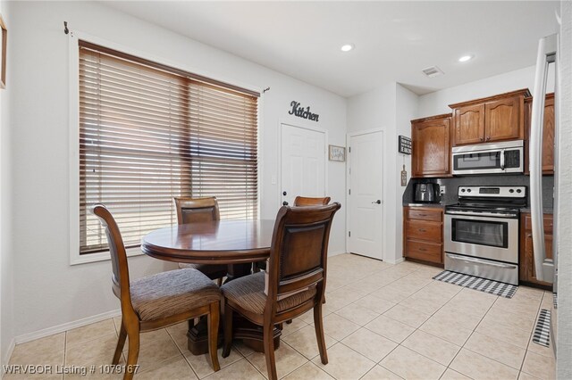 dining area featuring recessed lighting, visible vents, baseboards, and light tile patterned flooring