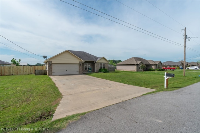 single story home featuring concrete driveway, a front yard, fence, brick siding, and a garage