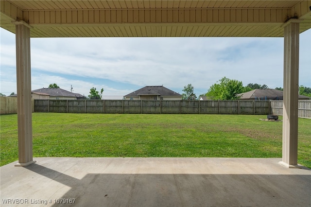 view of yard with a fenced backyard and a patio area