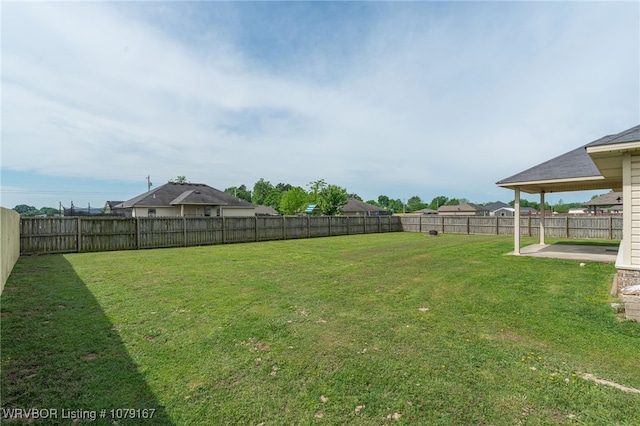 view of yard featuring a patio and a fenced backyard