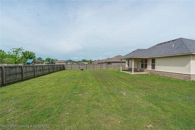 view of yard featuring a fenced backyard and a patio area