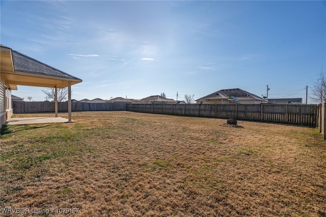 view of yard with a fenced backyard