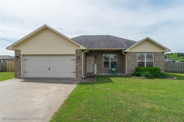 ranch-style house featuring driveway, a front yard, fence, brick siding, and a garage